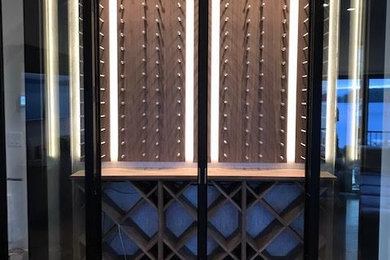 Inspiration for a mid-sized transitional ceramic tile wine cellar remodel in Charlotte