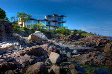 Inspiration for a huge contemporary beige three-story wood house exterior remodel in Portland Maine