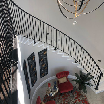 Grand Curved Staircase with Luxury Entry Seating Nook