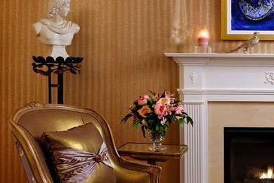 Example of a large transitional master carpeted and beige floor bedroom design in DC Metro with brown walls, a standard fireplace and a stone fireplace