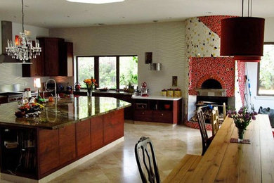Large trendy single-wall travertine floor open concept kitchen photo in Los Angeles with an undermount sink, dark wood cabinets, granite countertops, white backsplash, porcelain backsplash, stainless steel appliances and an island