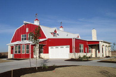 Example of a huge red two-story mixed siding exterior home design in Dallas with a gambrel roof
