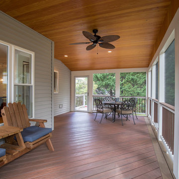 Screen porch with Wolf decking and T&G ceiling, recessed lights and ceiling fan.