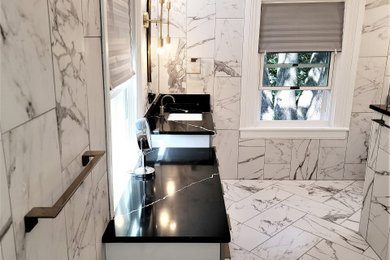 Example of a mid-sized mid-century modern master white tile and porcelain tile porcelain tile, white floor and double-sink bathroom design in Richmond with flat-panel cabinets, white cabinets, a two-piece toilet, white walls, an undermount sink, quartz countertops, a hinged shower door, black countertops, a niche and a freestanding vanity