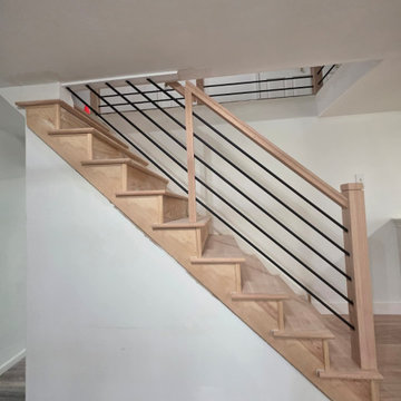 Horizontal Stair Railing with Red Oak T-Rail and Black Metal Bars