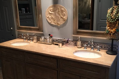 Inspiration for a large master bathroom in Dallas with an undermount sink, furniture-like cabinets, blue cabinets, a claw-foot tub, a corner shower, a two-piece toilet, beige tile, stone tile, blue walls and porcelain floors.