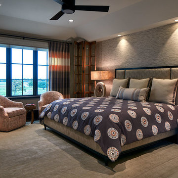 Brown and Taupe Bedroom with Swivel Lounge Chairs and Color-Block Window Panels