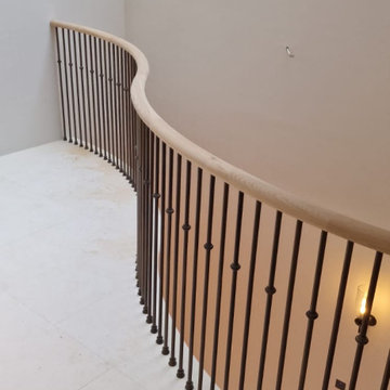 Oak handrail on a stone staircase