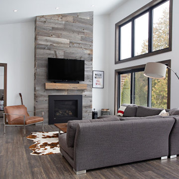 Barnboard fireplace in living rm.