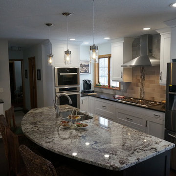Kitchen, hutch, buffet open to adjacent spaces