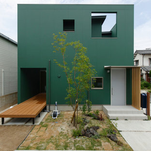 他の地域のモダンスタイルのおしゃれな家の外観 (緑の外壁) の写真