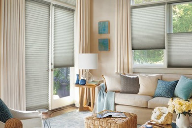 Inspiration for a coastal beige floor living room remodel in New York with beige walls, no fireplace and no tv