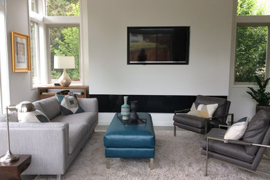 Design ideas for a mid-sized transitional open concept living room in Seattle with white walls, concrete floors, a ribbon fireplace, a plaster fireplace surround, a wall-mounted tv and grey floor.