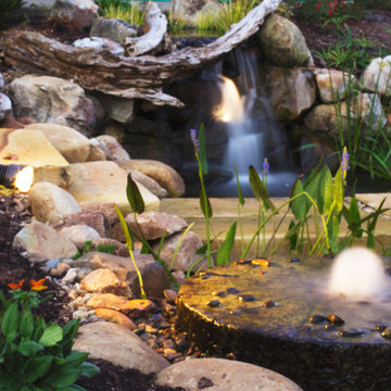 Waterfall and bubbling Grinding stone feature LED lighting example in Knoxville,
