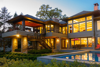 This is an example of an arts and crafts one-storey exterior in Minneapolis with wood siding.