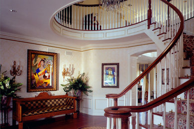 Inspiration for a mid-sized timeless wooden curved wood railing staircase remodel in New York with painted risers