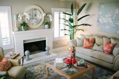 Living room - mid-sized coastal open concept carpeted living room idea in Orange County with beige walls, a standard fireplace, a brick fireplace and no tv