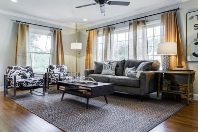 Living room - farmhouse medium tone wood floor living room idea in Dallas with gray walls