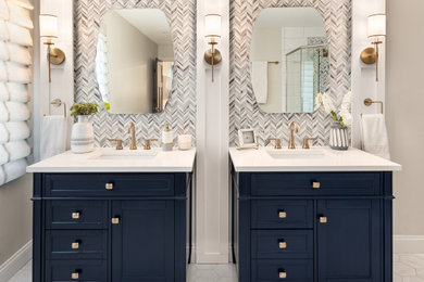 Double shower - mid-sized contemporary master porcelain tile porcelain tile and white floor double shower idea in Detroit with shaker cabinets, blue cabinets, gray walls, quartz countertops, a hinged shower door, white countertops and a freestanding vanity