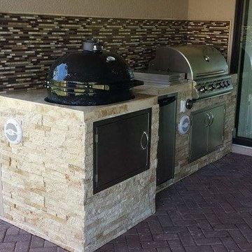 Outdoor Kitchen with Stacked Stone Exterior and Primo Oval