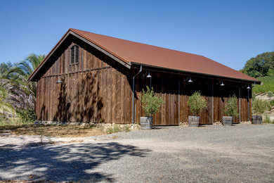 Example of a large mountain style brown one-story wood gable roof design in San Francisco