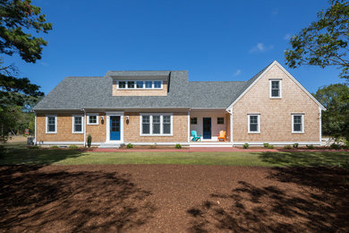 Inspiration for a large traditional partial sun front yard brick landscaping in Boston for summer.