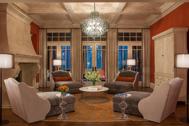 Inspiration for an expansive transitional open concept living room in Atlanta with a music area, orange walls, medium hardwood floors, a standard fireplace, a stone fireplace surround, a concealed tv and brown floor.