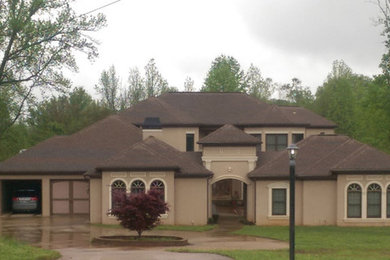 This is an example of a large contemporary two-storey beige exterior in Atlanta.