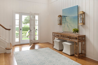 Inspiration for a beach style entryway in Boston with white walls.