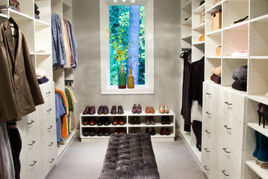 Inspiration for a transitional dressing room in Los Angeles with open cabinets, white cabinets and carpet.