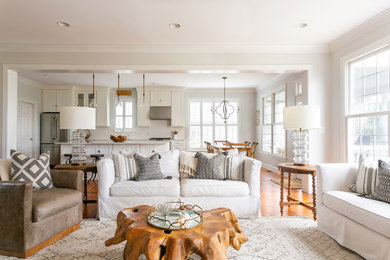Living room - large coastal open concept light wood floor and brown floor living room idea in Charleston with white walls, a standard fireplace, a tile fireplace and a wall-mounted tv