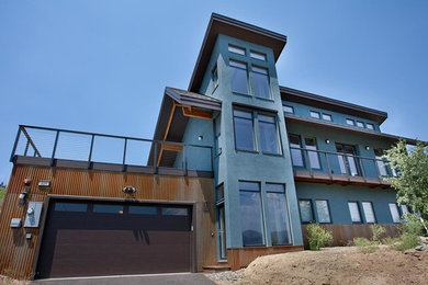 Mid-sized industrial blue three-story concrete exterior home idea in Sacramento