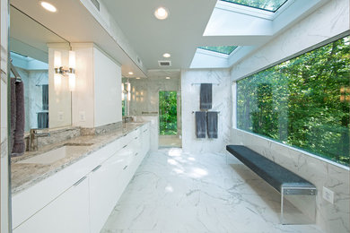 Example of a mid-sized trendy master white tile and porcelain tile porcelain tile, white floor and double-sink wet room design in DC Metro with flat-panel cabinets, white cabinets, a one-piece toilet, white walls, an undermount sink, quartzite countertops, a hinged shower door and gray countertops