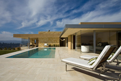 Pool - large modern backyard tile pool idea in San Francisco