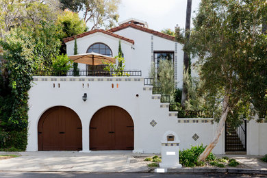 Example of a tuscan white exterior home design in Los Angeles