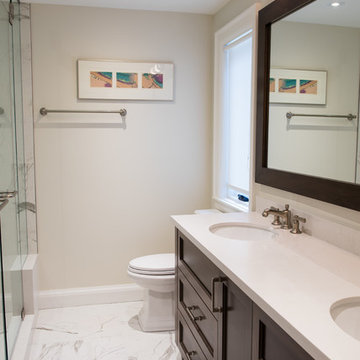 Dark Wood Cabinets, Frameless Shower Design, His and Her Sinks