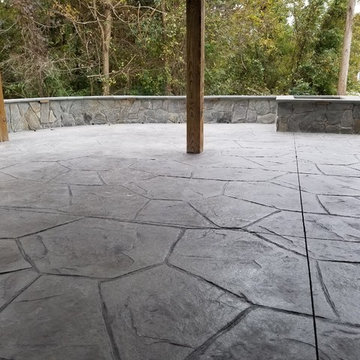 C-Stamped concrete patio with a wall