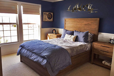 Example of a mid-sized transitional boy carpeted and beige floor kids' room design in Indianapolis with blue walls