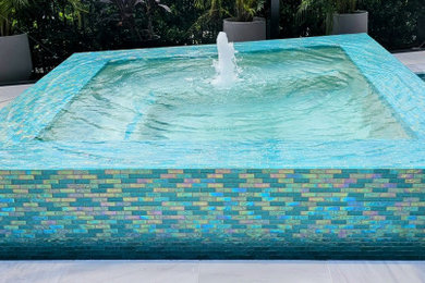 Large trendy backyard concrete paver and custom-shaped lap pool photo in Orlando