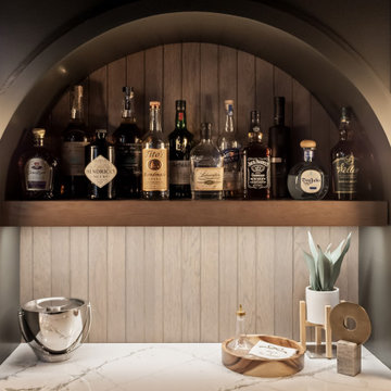 A Basement Built for Entertaining – With a Speakeasy Bar and Golf Simulator