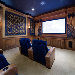 Inspiration for a traditional enclosed home cinema in Orlando with blue walls, carpet and beige floors.
