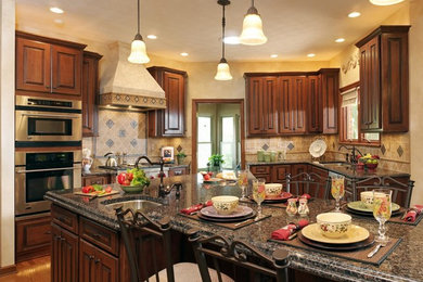Inspiration for a modern u-shaped eat-in kitchen remodel in Other with a drop-in sink, medium tone wood cabinets and stainless steel appliances