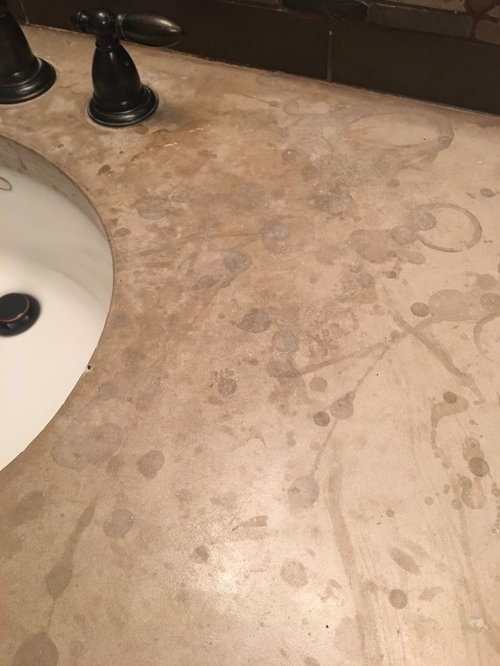 How do you clean spots on cement countertop?