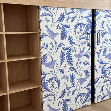 Custom Built-In Bookshelf with Blue Chinoiserie Sliding Panels