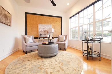 Example of a mid-sized transitional open concept ceramic tile living room design in Miami with beige walls, no fireplace and no tv