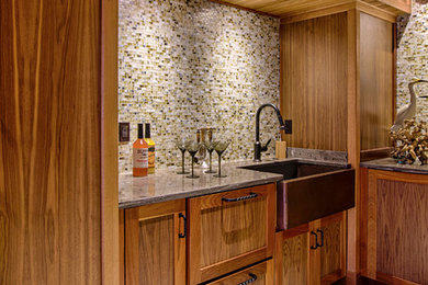 Elegant eat-in kitchen photo in Philadelphia with a farmhouse sink and glass tile backsplash