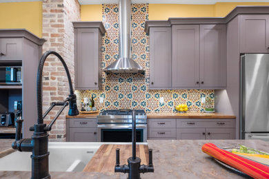 Eat-in kitchen - mid-sized farmhouse l-shaped multicolored floor eat-in kitchen idea in Denver with a double-bowl sink, shaker cabinets, gray cabinets, marble countertops, multicolored backsplash, stainless steel appliances, an island and multicolored countertops