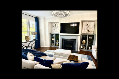 Living room - mid-sized transitional open concept brown floor living room idea in Raleigh with a standard fireplace, a wood fireplace surround and a wall-mounted tv