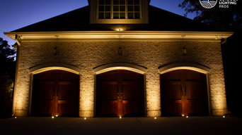 Illuminating the rich wood doors helps to welcome the family home safely