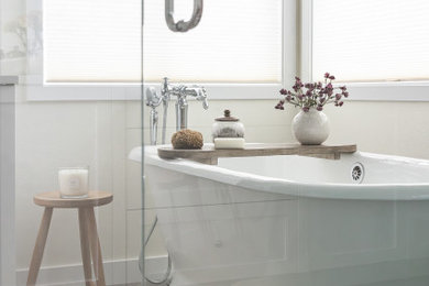 Inspiration for a large coastal master double-sink freestanding bathtub remodel in Portland with shaker cabinets, white cabinets, a pedestal sink, quartzite countertops, white countertops and a built-in vanity